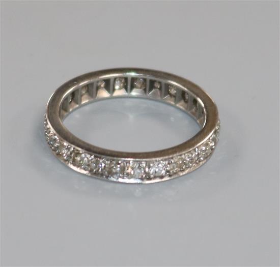 A white metal and diamond set full eternity ring, size Q.